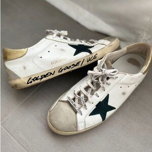 Men’s Golden Goose White and Gold Sneakers with Black Accents
